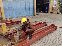 man drilling hole